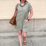 Sage green collared mini dress with short sleeves and front pockets.