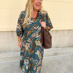 Teal collared midi dress with light orange, navy, and light blue floral-style print