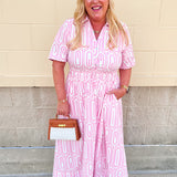 Pink geometric print short sleeve dress with smocked waist