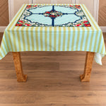 Palm Beach Stripe Tablecloth On a Burl wood table with the Winterberry Mahjong mat 