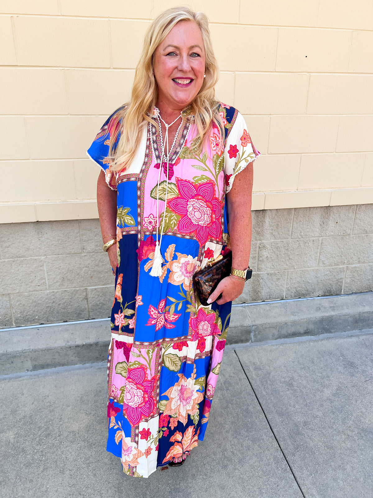 Multicolor floral midi dress with flutter sleeves and tassel tie neckline