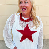 An oversized open-stitch knit sweater top featuring a bold star jacquard design and relaxed long sleeves.