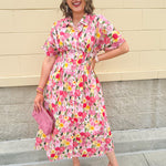 Floral cotton midi dress with pink and yellow flowers, drop shoulder sleeves, smocking, and pockets