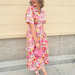 Floral cotton midi dress with pink and yellow flowers, drop shoulder sleeves, smocking, and pockets