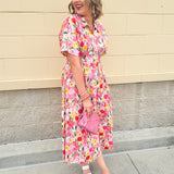 Floral cotton midi dress with pink and yellow flowers, drop shoulder sleeves, smocking, and pockets