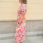 Floral cotton midi dress with pink and yellow flowers, drop shoulder sleeves, smocking, and pockets