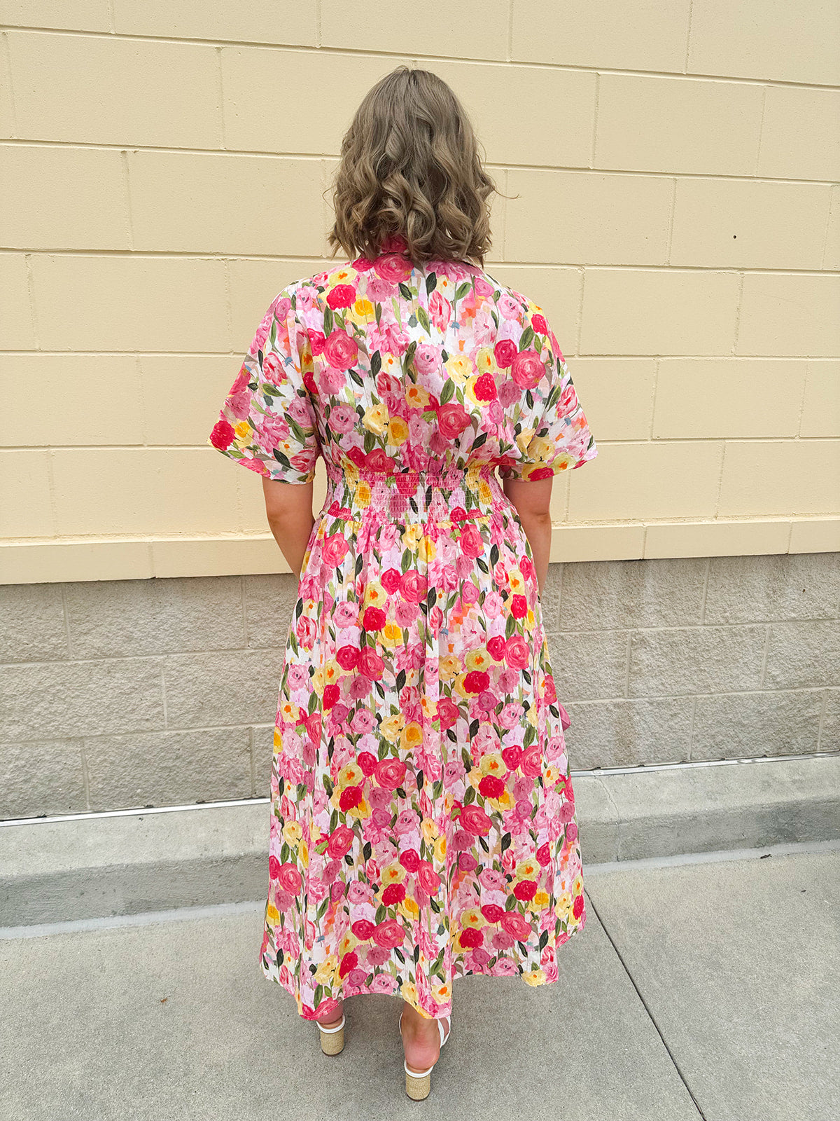 Floral cotton midi dress with pink and yellow flowers, drop shoulder sleeves, smocking, and pockets