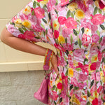 Floral cotton midi dress with pink and yellow flowers, drop shoulder sleeves, smocking, and pockets