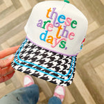 White embroidered canvas hat with houndstooth brim and colorful embroidered icons