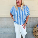Model wearing the Picnic Chic Round Neck Striped Top featuring dolman sleeves, elastic cuffs, and a slightly boxy silhouette – styled for an effortless summer look perfect for picnics and casual outings