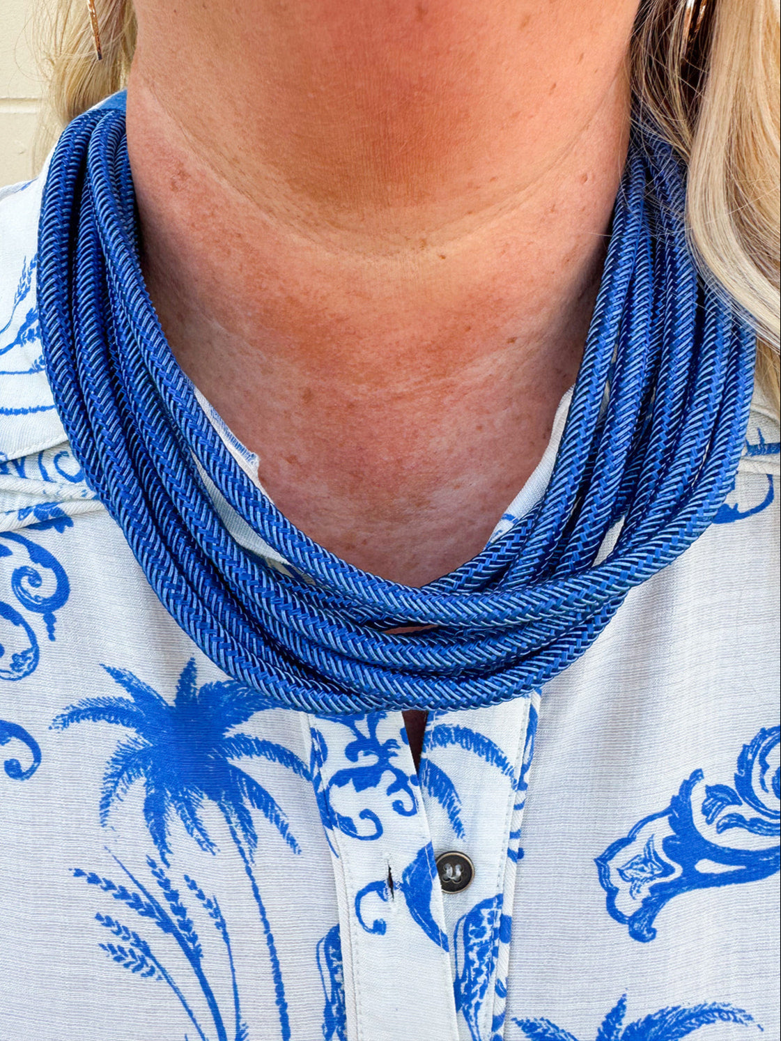 Rachel Rope Necklace displayed to show its 8 strands of soft cotton roping and 24-inch length, featuring a ball-and-eye closure – a lightweight statement piece perfect for layering or solo wear