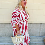 Model Crystal wearing the Red, White & Boom Dolman Sleeve Midi Dress featuring a bold zebra print, dolman sleeves, and a flattering elastic waist – styled for a confident, comfortable look perfect for day or night