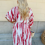 Model Crystal wearing the Red, White & Boom Dolman Sleeve Midi Dress featuring a bold zebra print, dolman sleeves, and a flattering elastic waist – styled for a confident, comfortable look perfect for day or night