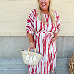 Model Crystal wearing the Red, White & Boom Dolman Sleeve Midi Dress featuring a bold zebra print, dolman sleeves, and a flattering elastic waist – styled for a confident, comfortable look perfect for day or night