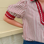 Rust and cream striped pullover top with puff sleeves, contrast rust cuffs and split collar—lightweight and perfect for early fall