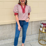 Rust and cream striped pullover top with puff sleeves, contrast rust cuffs and split collar—lightweight and perfect for early fall