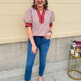 Rust and cream striped pullover top with puff sleeves, contrast rust cuffs and split collar—lightweight and perfect for early fall