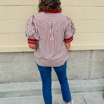 Rust and cream striped pullover top with puff sleeves, contrast rust cuffs and split collar—lightweight and perfect for early fall