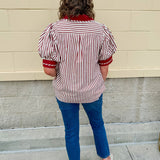 Rust and cream striped pullover top with puff sleeves, contrast rust cuffs and split collar—lightweight and perfect for early fall