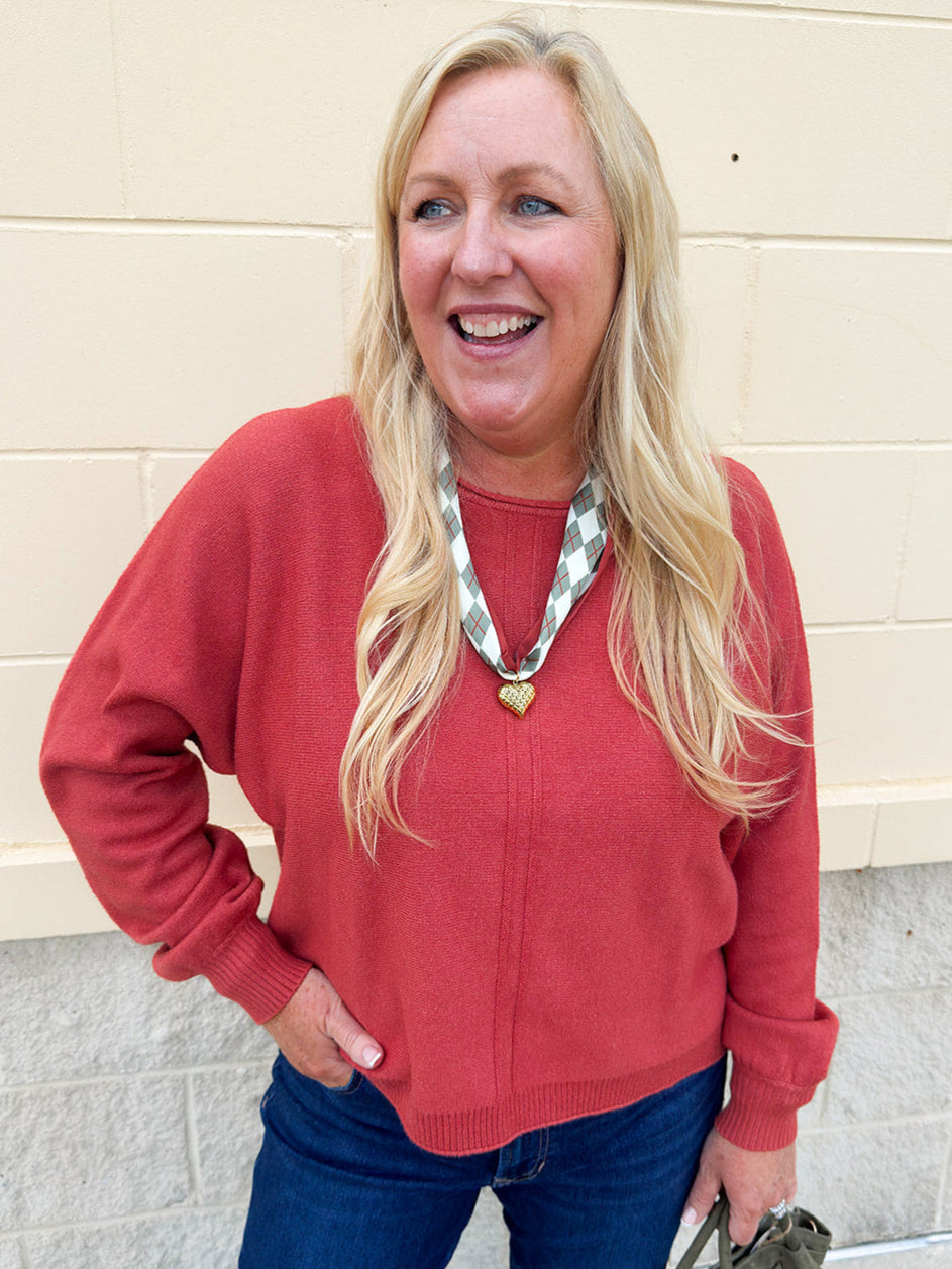 Rust viscose sweater with round neck and double front seam detail