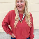 Rust viscose sweater with round neck and double front seam detail