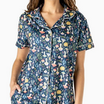 Navy pajama top with colorful mushroom print, button-down front, collar, and piping detail.