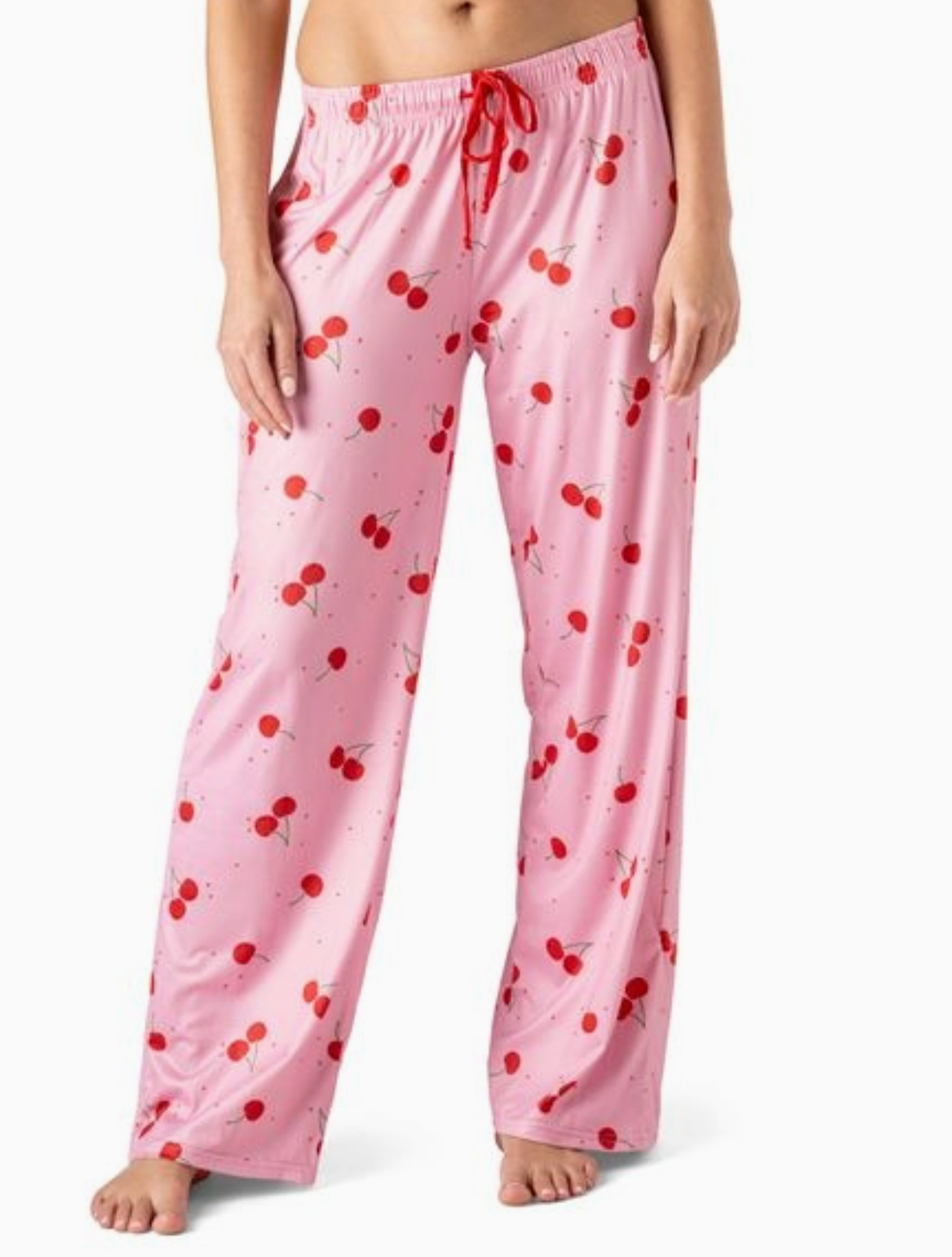 Pink pajama pants with red cherry print, wide-leg fit and elastic waistband.
