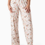 Cream pajama pants with cactus and cowgirl print, wide-leg fit, and elastic waistband with drawstring tie.