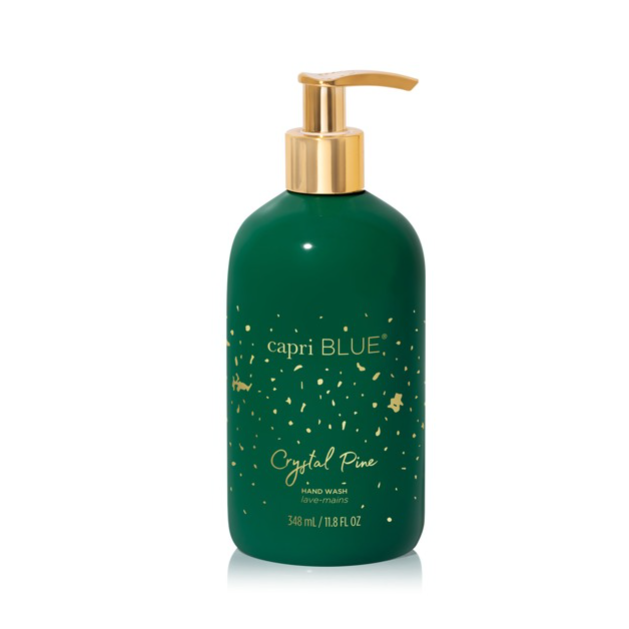 Capri Blue Crystal Pine Hand Wash bottle with green and gold design.