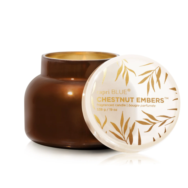 Candle and container with 'Chestnut Embers' text on a white background