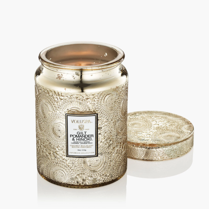 Large embossed glass jar candle with Japonica-detailed metal lid.