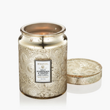 Large embossed glass jar candle with Japonica-detailed metal lid.