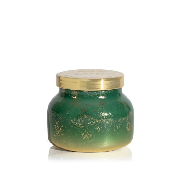 Capri Blue Glimmer Crystal Pine 19oz candle in green and gold ombré glass vessel.