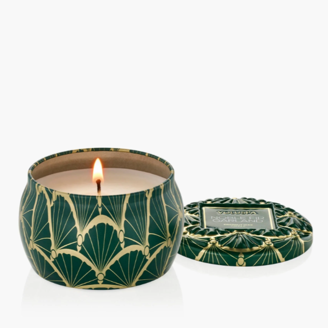 Mini holiday candle in decorative tin with embossed lid and festive metallic accents.