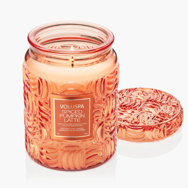 Large fall candle in embossed pumpkin-patterned glass jar with matching lid.