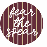 Florida State gameday button with garnet background, thin gold stripes, and white cursive Fear the Spear lettering.