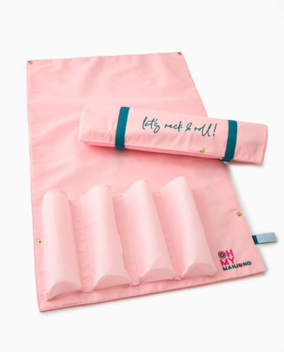 Light pink embroidered storage bag with Velcro closure, designed to hold and organize racks and pushers.