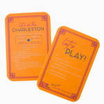 Orange Mahjong tile shufflers with printed rules and tips