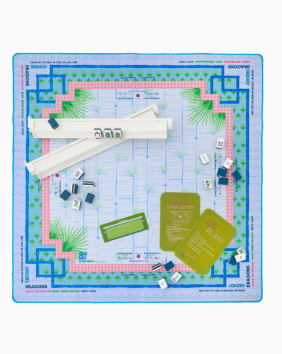 Tropical Mahjong mat with watercolor palms in blues and greens, accented with pink, rolled with canvas bag