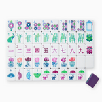 Gemma Mahjong Tiles in jewel tones of purple, green, and berry with dice/coin bag and instructional cards