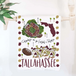 Garnet and gold tea towel with hand-drawn Doak Campbell Stadium and “Tallahassee, FL” design.