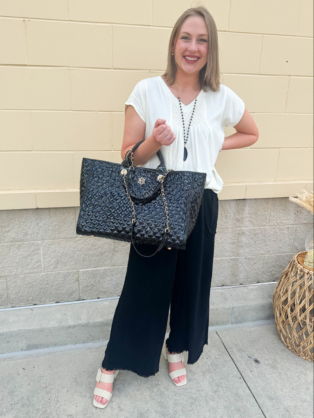  Neutral short sleeve top with smocking and pleated details, styled for a casual polished look