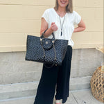  Neutral short sleeve top with smocking and pleated details, styled for a casual polished look