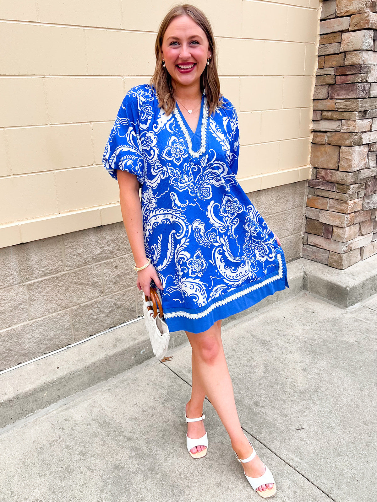 Blue and ivory printed mini dress with lace trim neckline