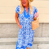 Blue and white printed midi dress with contrast neckline and flutter sleeves