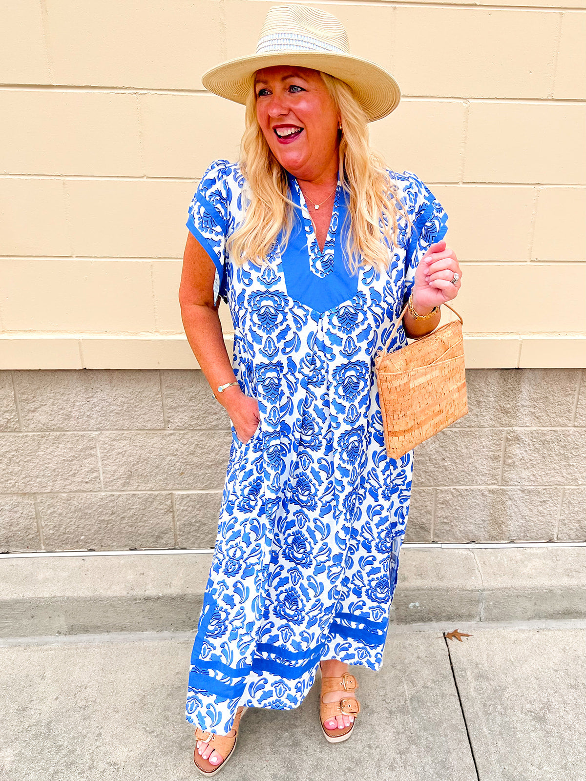 Blue and white printed midi dress with contrast neckline and flutter sleeves