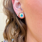 A pair of Sorrelli Halcyon Stud Earrings in Crystal Aurora Borealis, featuring a gold-colored setting and a large, multicolored, round crystal.