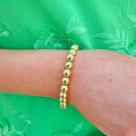 Elegant gold stretch bracelet with a timeless design, crafted for everyday wear and effortless layering.