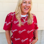Women's cream puff sleeve knit sweater featuring scattered crimson cursive bama lettering and a classic crew neckline.