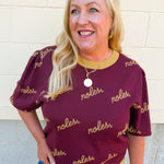 Women's garnet puff sleeve knit sweater featuring scattered gold cursive FSU lettering and a classic crew neckline.